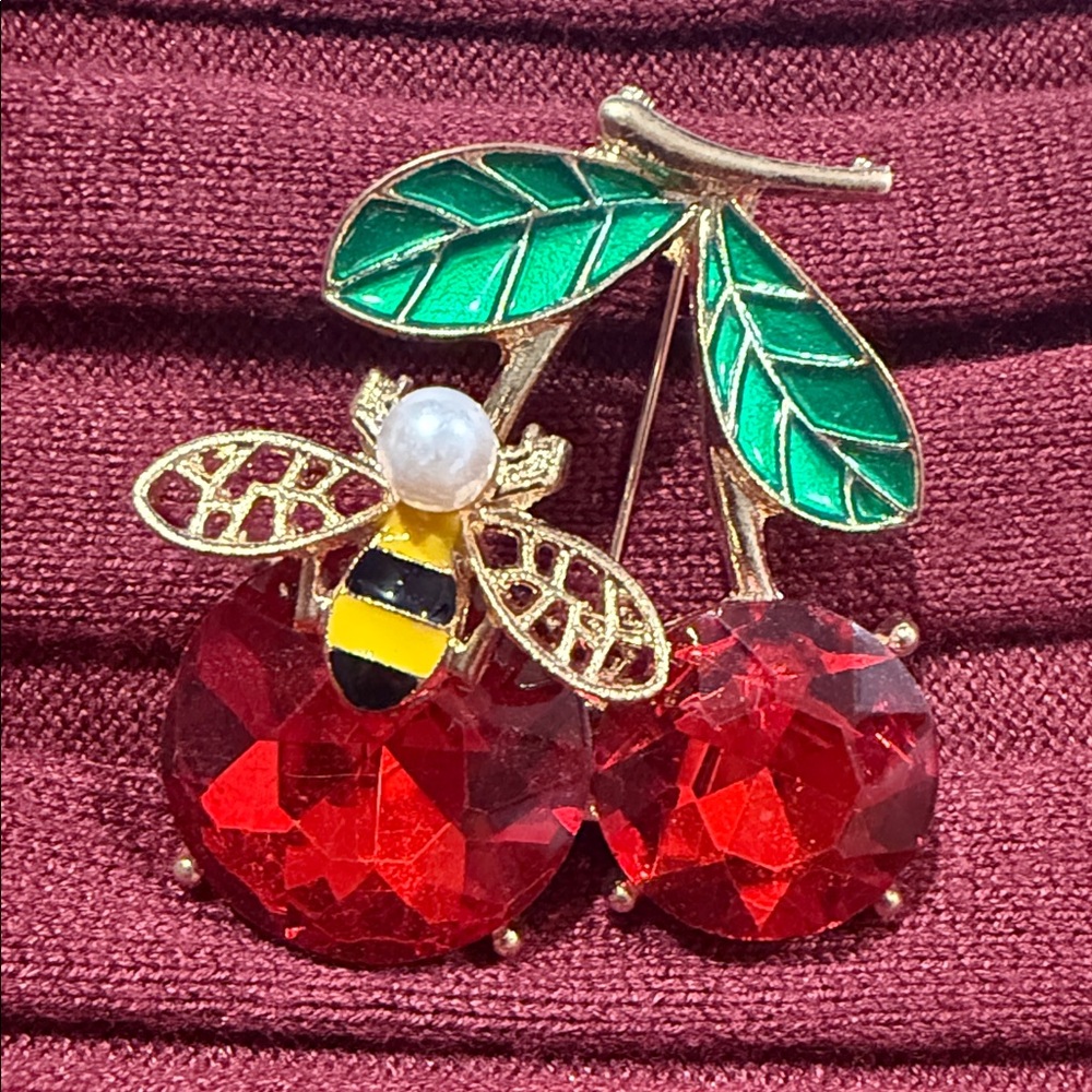 Elegant Gold and Red Cherry Brooch with Bee Accent